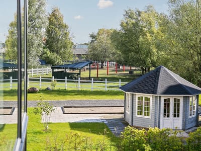 Outdoor garden area with a gazebo and greenery