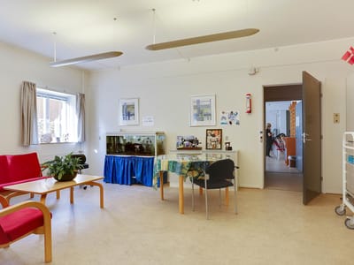 Common area with a dining table and aquarium