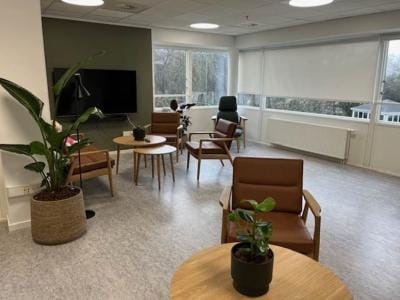 Verdishave, retirement home in Copenhagen, DK — Lounge area with seating and plants in a senior facility