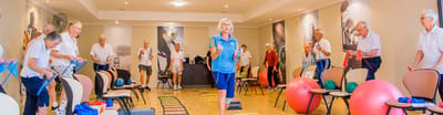 Seniors participating in a group exercise class