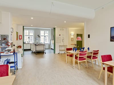 Interior view of a communal area with tables and chairs