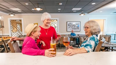 Residents enjoying drinks in a common area