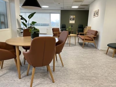 Bright common area with seating and plants