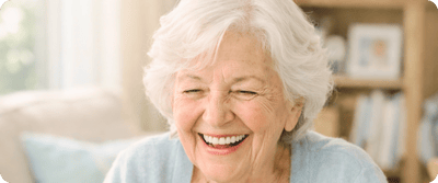 Happy elderly woman smiling brightly