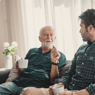 Two men in conversation in a common area