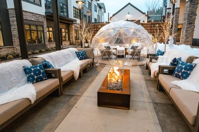 Outdoor lounge area with fire pit and seating