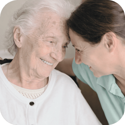 A caregiver and resident sharing a moment