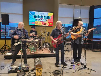 Live band performing in a common area.