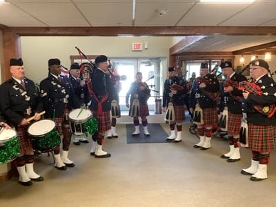 Bagpipe band performing in a common area