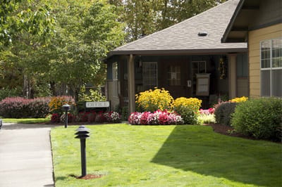 Exterior of the office with landscaped flowers