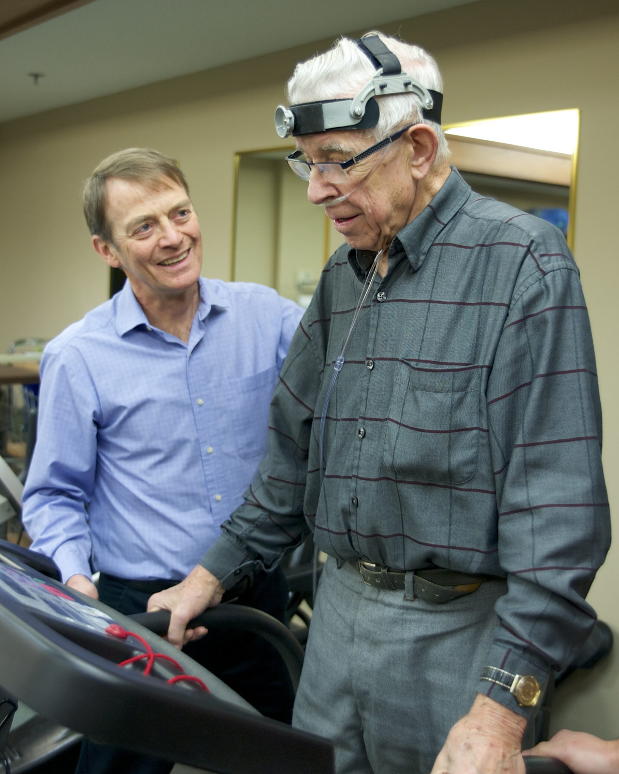 Staff assisting resident with physical therapy