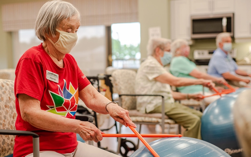 Resident participating in a therapeutic exercise class.