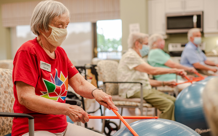 Residents participating in a group exercise activity.