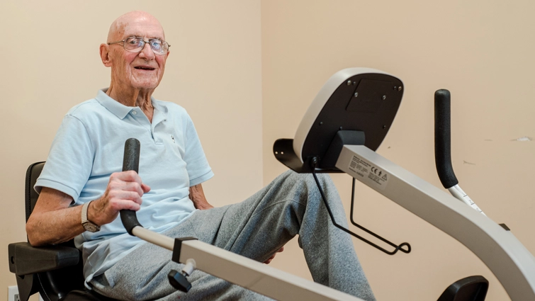 Senior man exercising on a stationary bike