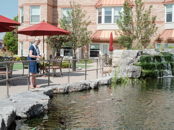 Resident enjoying the outdoor pond area.