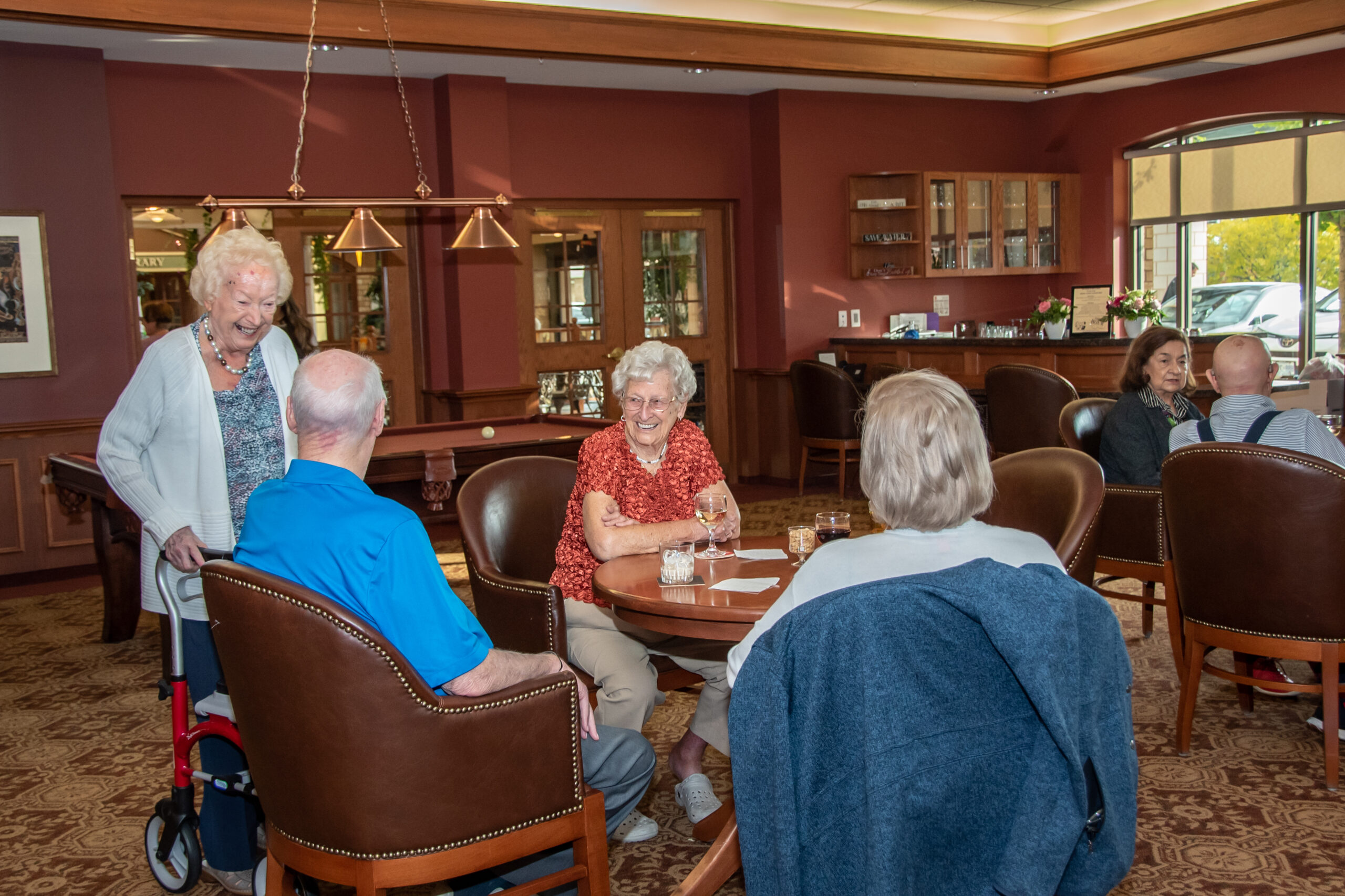 Residents enjoying conversation in a common area.