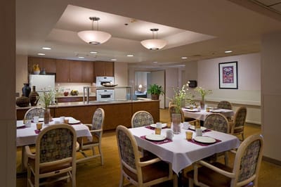 Dining area with tables set for residents