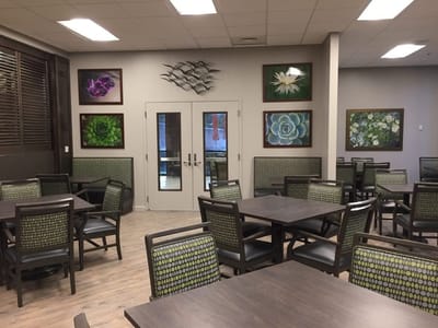 Interior dining room with artwork on walls