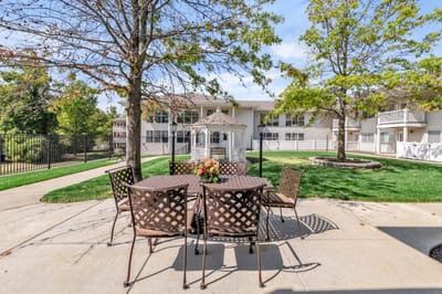 Outdoor seating area with gazebo and gardens