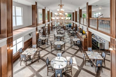 Elegant dining room with tables and chairs.