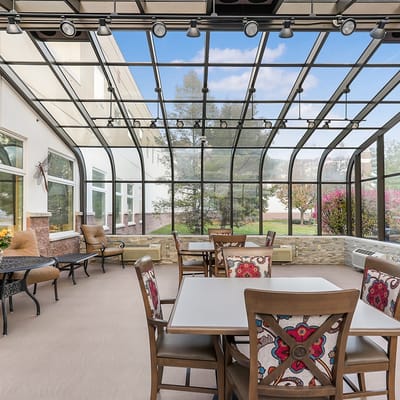 Sunroom seating area with tables and chairs