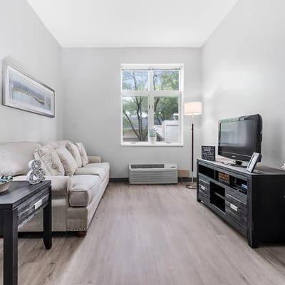 Cozy living room with sofa and lamp in a facility