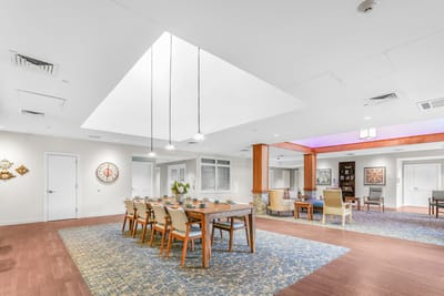 Bright dining room with a large table and decorative accents