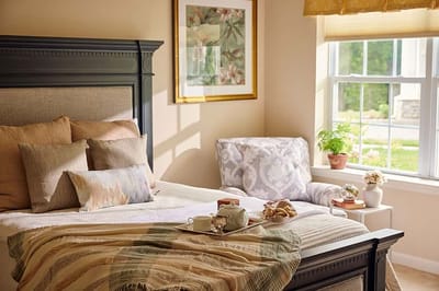 Cozy bedroom in a senior living facility with natural light