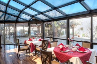 Interior dining room with decorated tables and flowers