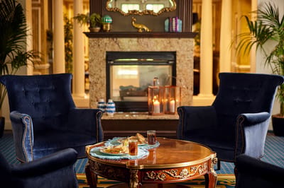 Cozy lounge area with chairs and snacks on a table