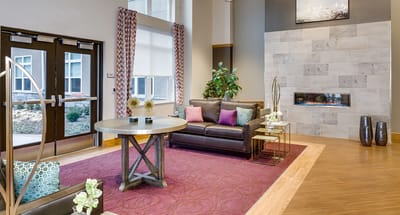 Bright interior common area with seating and decor