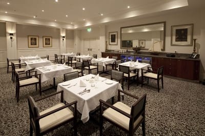 Elegant dining room with table settings and decor