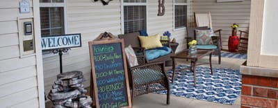 Welcoming outdoor seating area with activity schedule