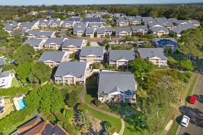 Aerial view of the retirement village with gardens and buildings