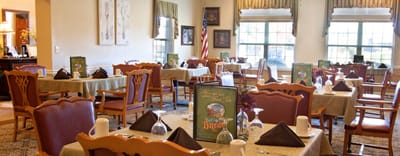 Dining room with neatly set tables and decor