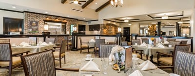 Elegant dining room setup with tables and chairs