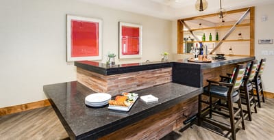 Interior of a modern bar area with food presentation