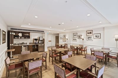 Spacious dining room with wooden tables and chairs