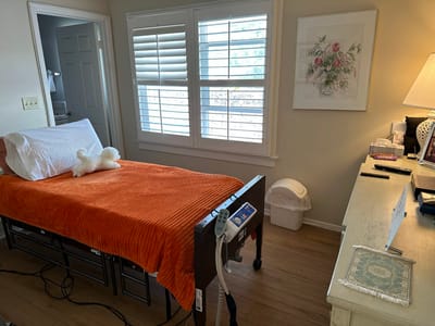 Interior view of a resident room with a bed and decor