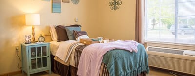 Cozy resident room with bed and decorative accents