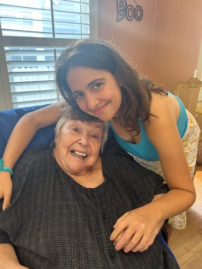 A resident and visitor sharing a joyful moment
