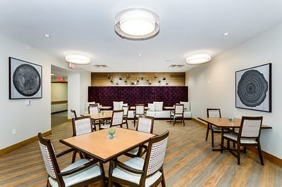 Bright dining room with modern decor and wooden tables