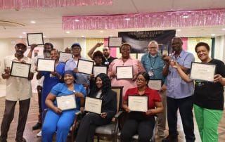 Atrium Center for Rehabilitation & Nursing, Nursing Home in Brooklyn, NY — Group of people holding certificates in a celebration setting