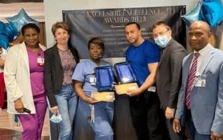 Atrium Center for Rehabilitation & Nursing, Nursing Home in Brooklyn, NY — Staff members celebrating award recipients at a ceremony