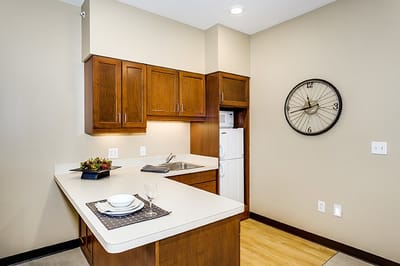 Well-furnished kitchen area in a resident unit