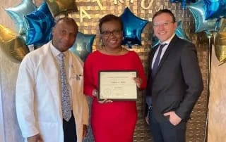 Atrium Center for Rehabilitation & Nursing, Nursing Home in Brooklyn, NY — Celebration of achievement with award presentation and balloons