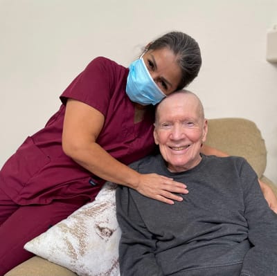 Staff member and resident smiling together
