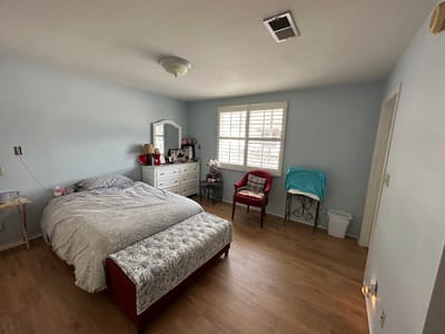 Cozy private resident room with bed and furniture