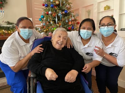 Staff and resident celebrating during the holiday season