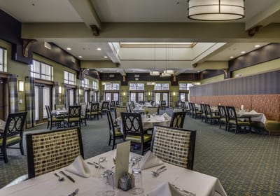 Dining room with tables set for a meal